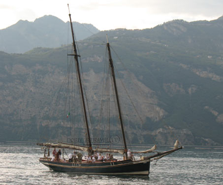 Boat with engine and sail Lake Garda